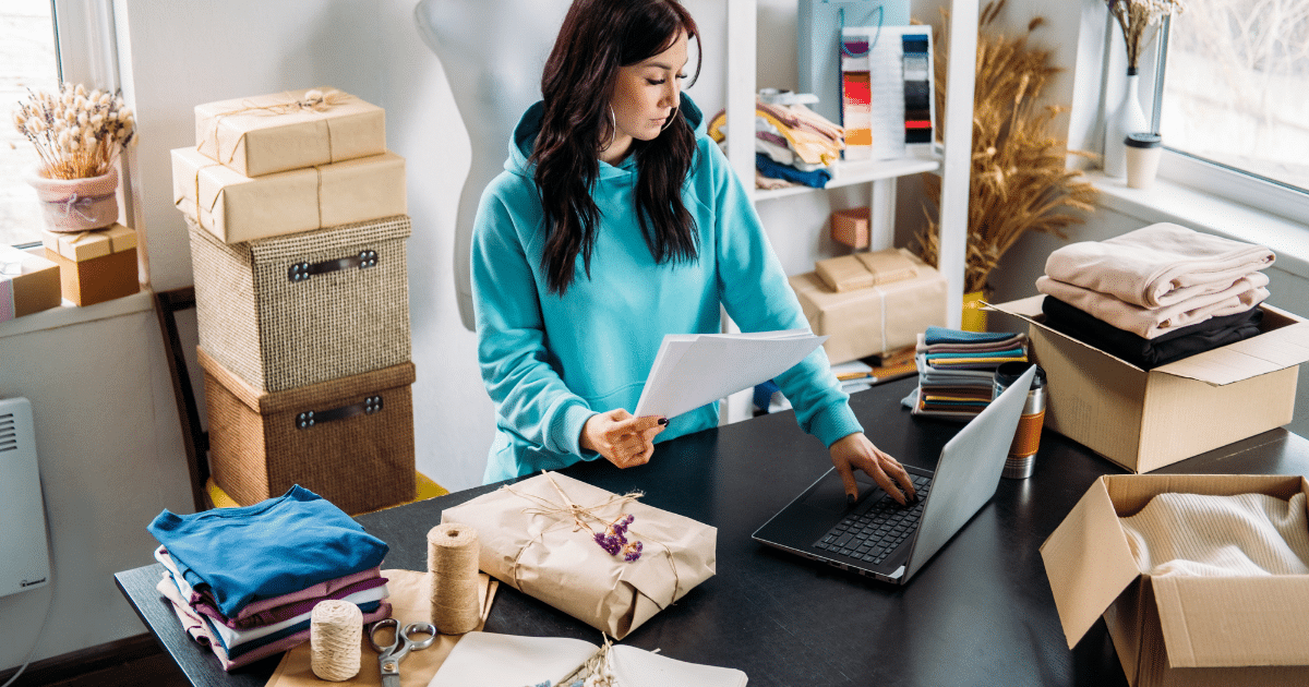 Woman managing online business with laptop, showcasing internet marketing trends and e-commerce strategies.