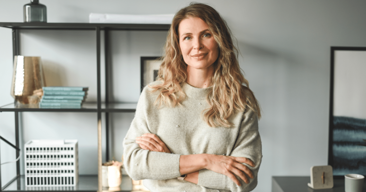 Woman entrepreneur in a cozy office setting, representing small business growth and funding solutions.