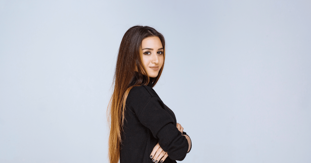 Professional woman with long hair, showcasing confidence and teamwork, ideal for hiring strategies in business.